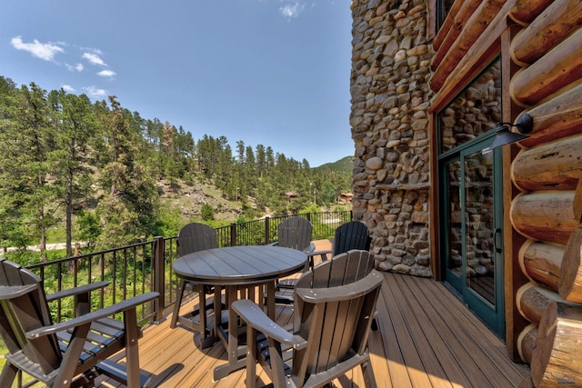 wooden deck with outdoor dining area