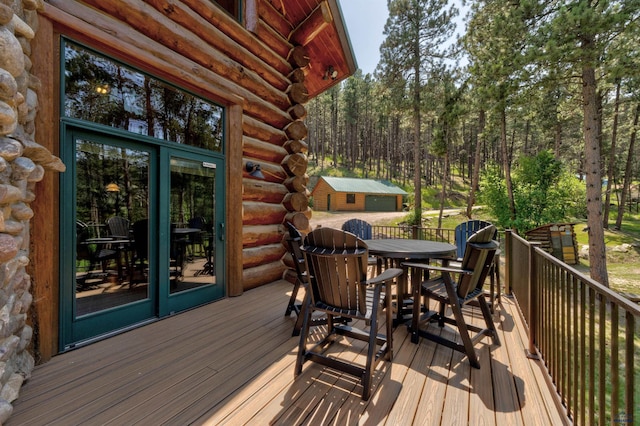 wooden terrace with outdoor dining space