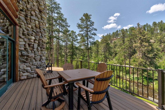 wooden deck with outdoor dining space