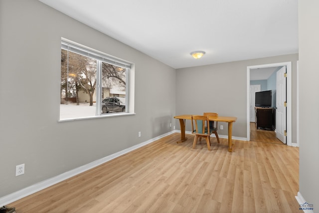 office with wood finished floors and baseboards