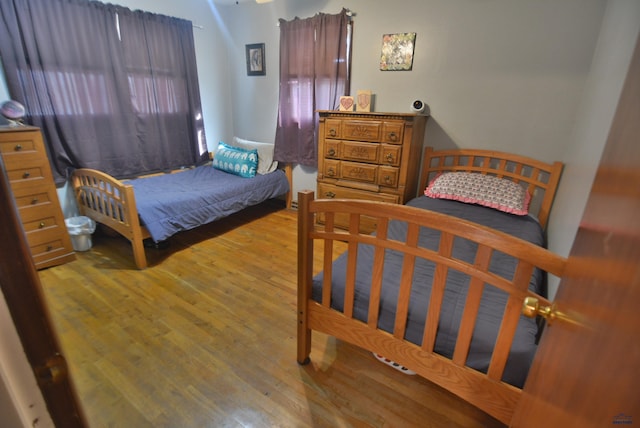 bedroom featuring wood finished floors