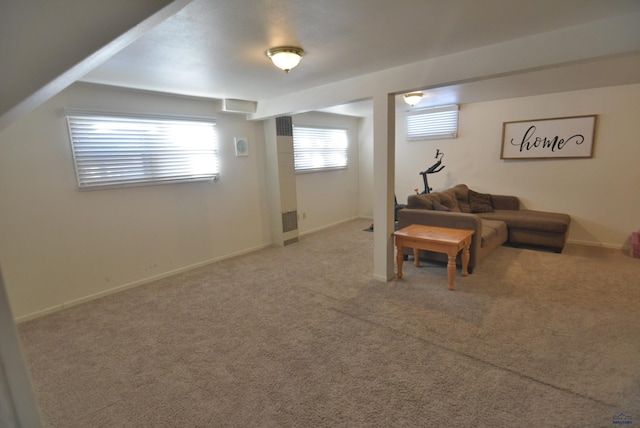 living area featuring visible vents, baseboards, and carpet