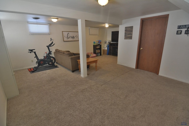 exercise room with carpet flooring, baseboards, and visible vents