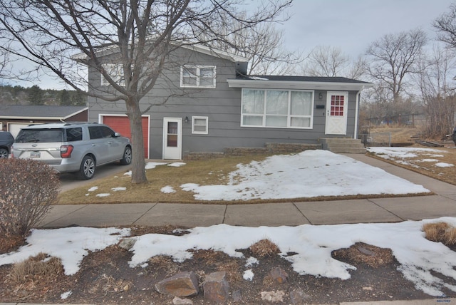 tri-level home featuring driveway and a garage