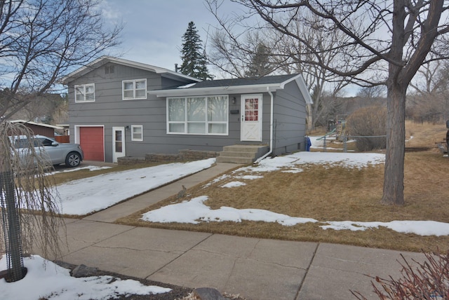 split level home featuring a garage