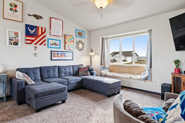 living room featuring ceiling fan, baseboards, and lofted ceiling