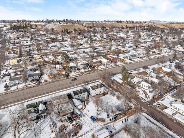 snowy aerial view with a residential view