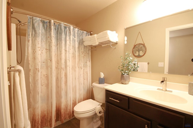 bathroom with a shower with shower curtain, toilet, and vanity