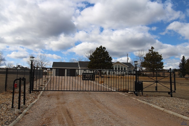 view of gate with fence