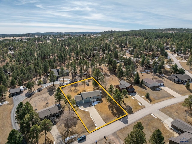 aerial view with a wooded view