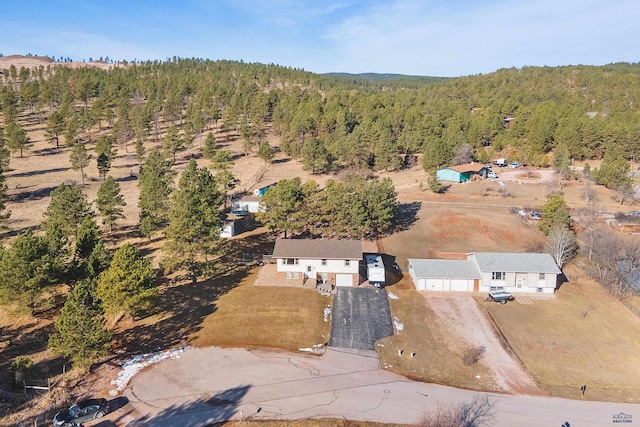 bird's eye view featuring a forest view