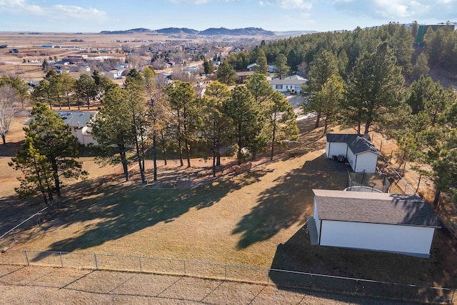 birds eye view of property with a mountain view