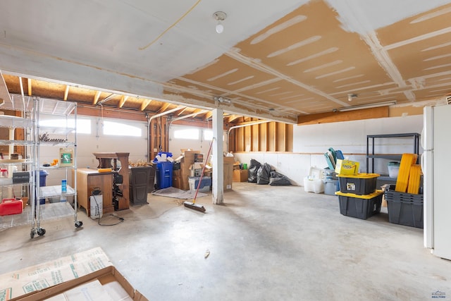 garage with freestanding refrigerator