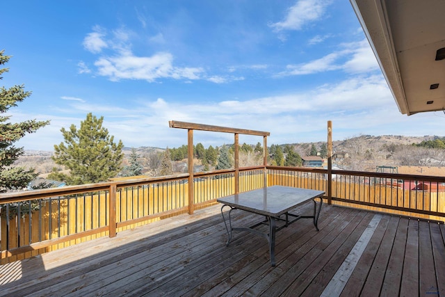 wooden terrace with a mountain view