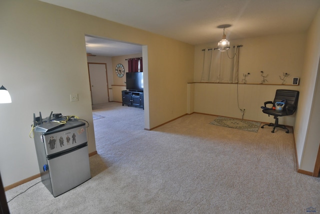 dining space with baseboards and carpet floors