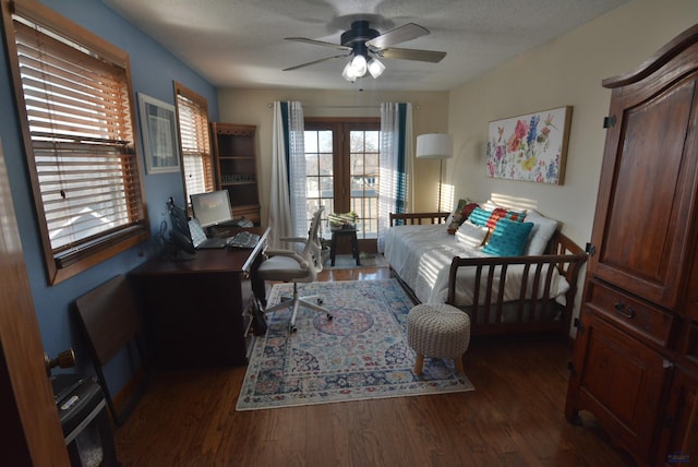 home office featuring a textured ceiling, wood finished floors, and ceiling fan