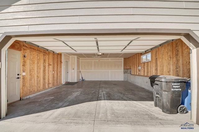 garage with wood walls