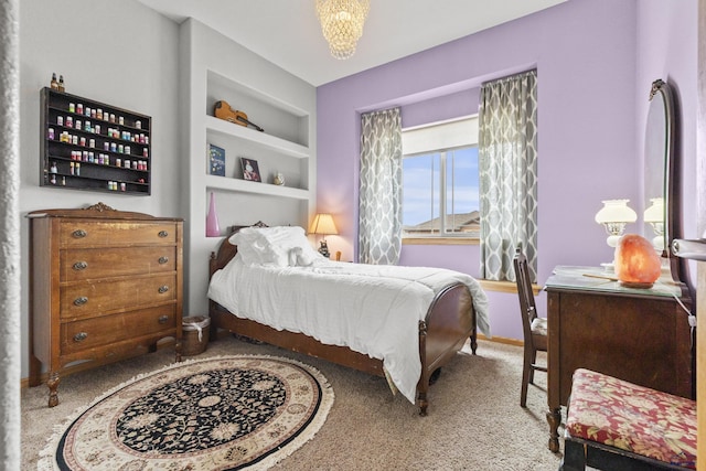 bedroom featuring carpet flooring and baseboards