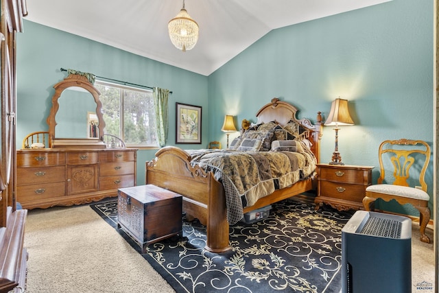 bedroom featuring a chandelier, carpet, and lofted ceiling