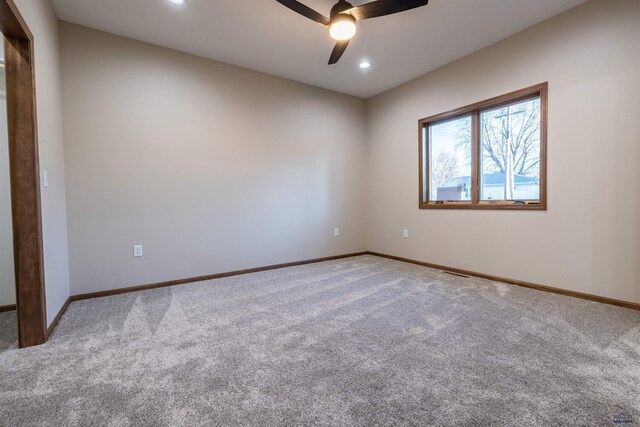 unfurnished room with light carpet, recessed lighting, a ceiling fan, and baseboards