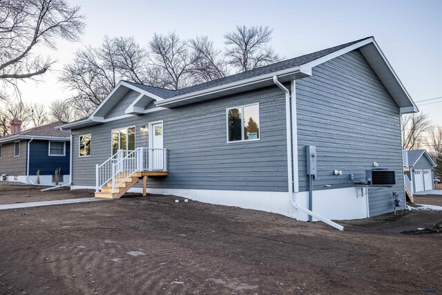 ranch-style house with central AC unit