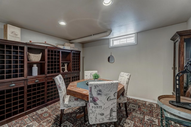 wine cellar with recessed lighting and baseboards