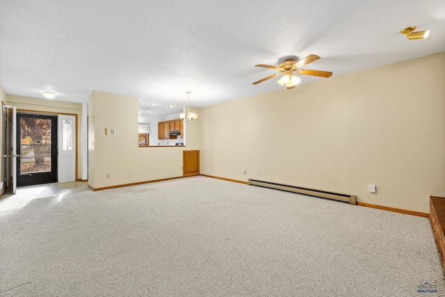 unfurnished living room featuring a baseboard heating unit, baseboards, light colored carpet, ceiling fan with notable chandelier, and a textured ceiling