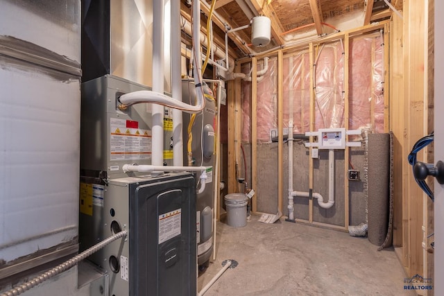 utility room featuring heating unit and water heater