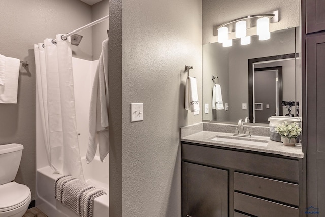 6748 Receda St, Rapid City, SD 57703 - bathroom with toilet, shower / tub combo with curtain, vanity, and a textured wall