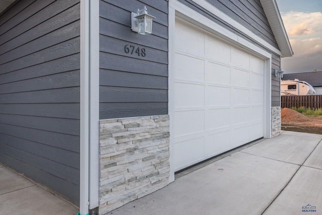 garage featuring fence