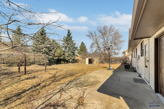 view of yard with a patio and fence