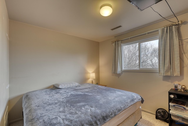 bedroom with visible vents, baseboards, and carpet floors
