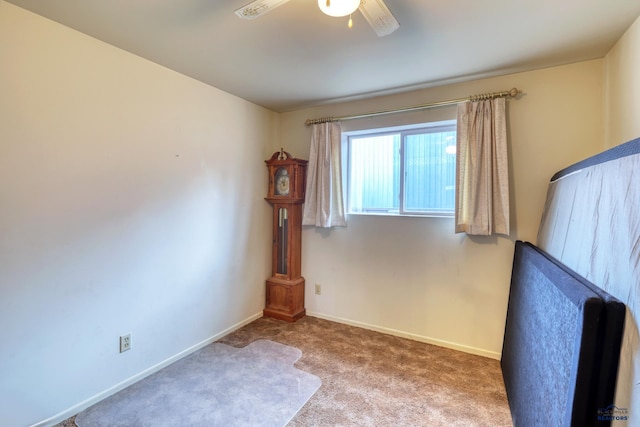 unfurnished bedroom with a ceiling fan, baseboards, and carpet floors