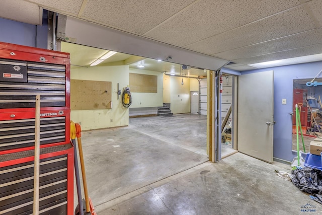finished below grade area with a paneled ceiling