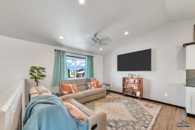 living room with light wood-type flooring, recessed lighting, baseboards, lofted ceiling, and ceiling fan