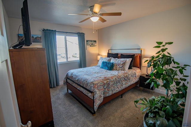 bedroom with carpet flooring, baseboards, and ceiling fan