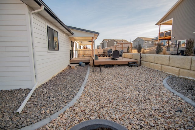 view of yard featuring a wooden deck and a fenced backyard