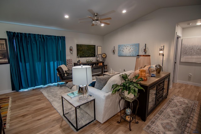 living area with recessed lighting, wood finished floors, ceiling fan, and vaulted ceiling