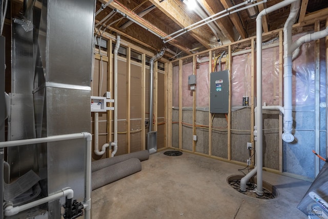 unfinished basement with electric panel and heating unit