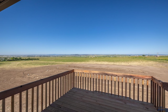 wooden terrace with a rural view