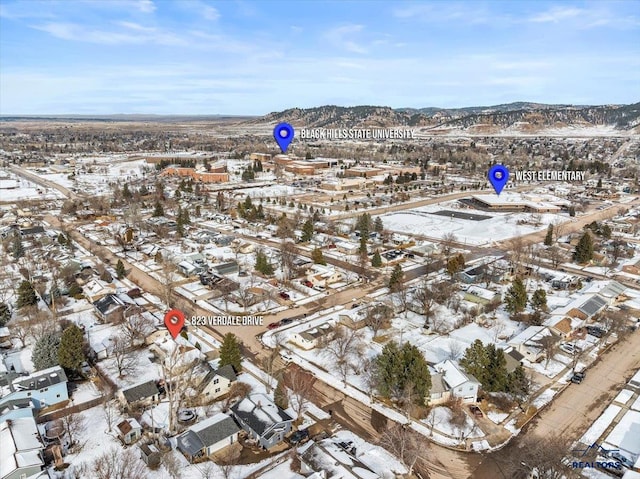 birds eye view of property with a mountain view and a residential view