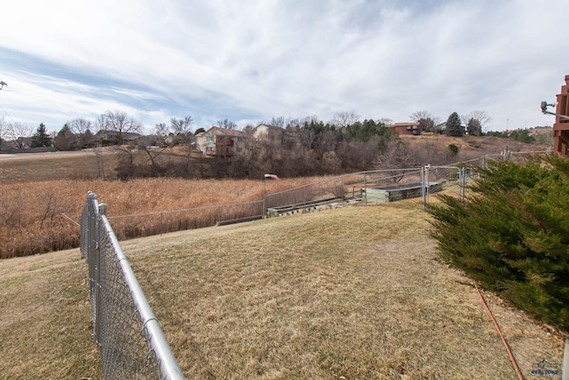 view of yard with a rural view and fence