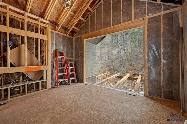 misc room with lofted ceiling