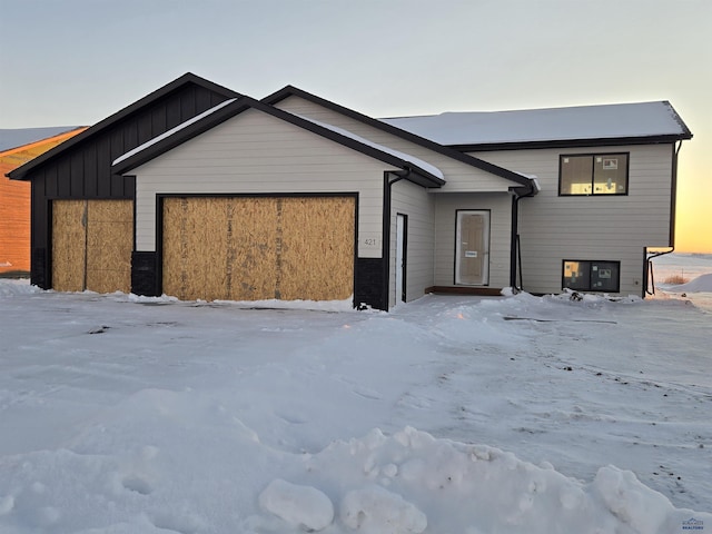 view of front of house with board and batten siding and an attached garage