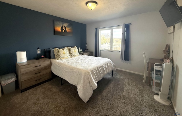 carpeted bedroom featuring baseboards and a textured ceiling