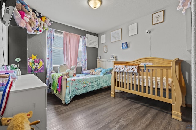 bedroom featuring wood finished floors