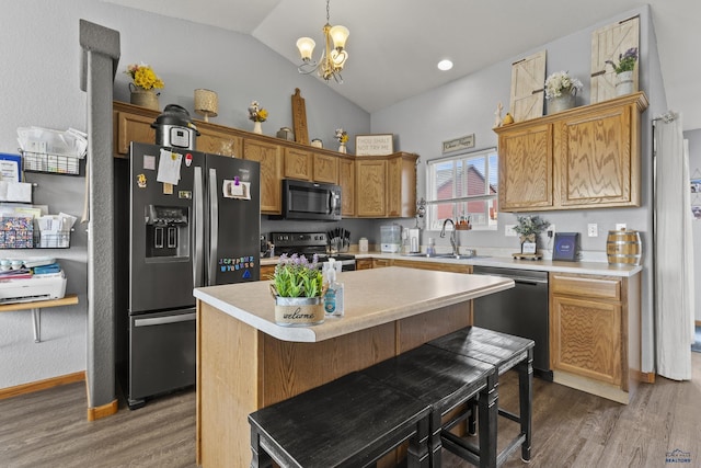 kitchen featuring dishwashing machine, a sink, light countertops, electric stove, and fridge with ice dispenser