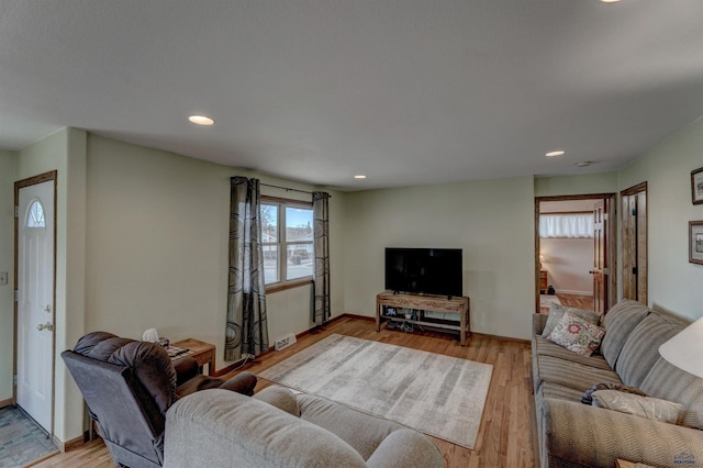 2204 Cruz Dr, Rapid City, SD 57702 - living area featuring light wood finished floors, recessed lighting, and baseboards
