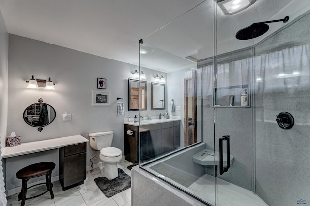 2204 Cruz Dr, Rapid City, SD 57702 - full bathroom with a shower stall, baseboards, toilet, marble finish floor, and vanity