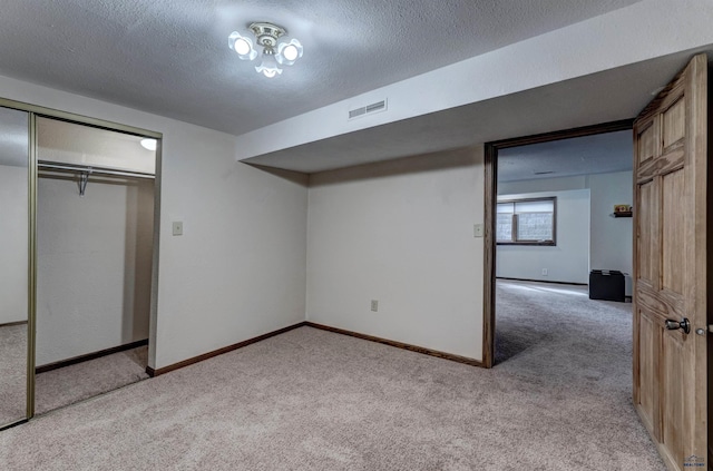 2204 Cruz Dr, Rapid City, SD 57702 - unfurnished bedroom featuring baseboards, visible vents, a textured ceiling, and carpet